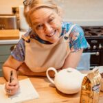 Kate offers a warm welcome to afternoon tea at Moss Cottage, Croughton, Northamptonshire.